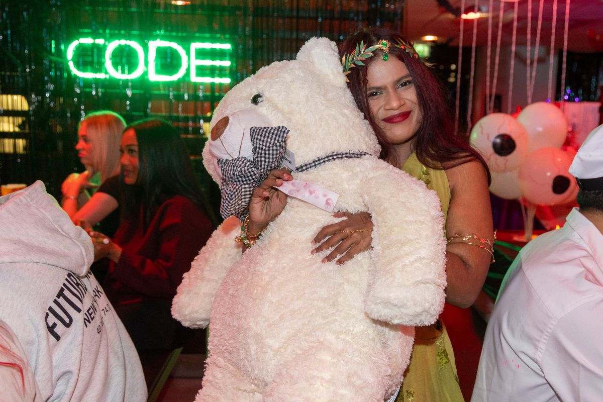 A CODE student tenant with the massive teddy bear