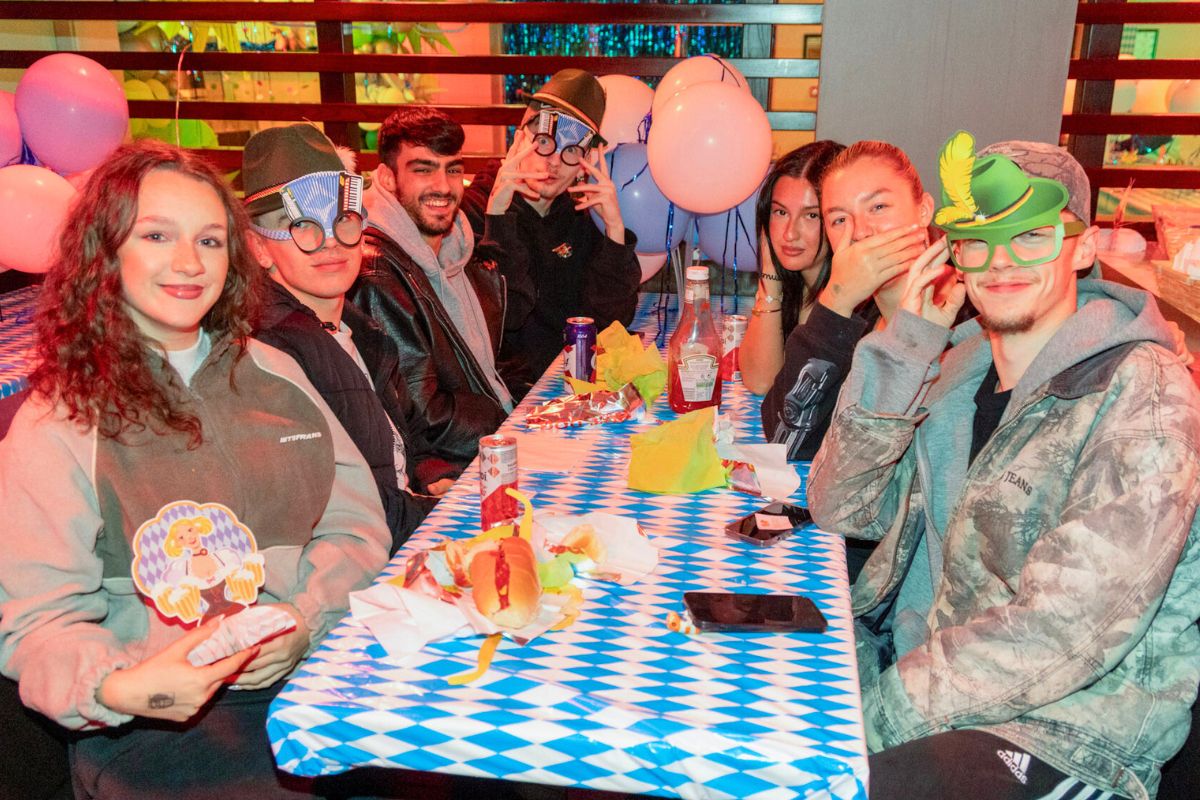 Students sitting around a table at the CODE Welcome event