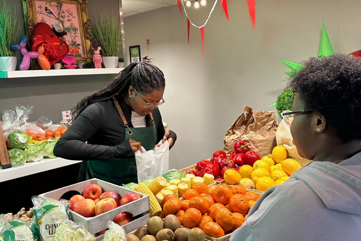 A CODE students picking their fruit and veg that they can grab for free