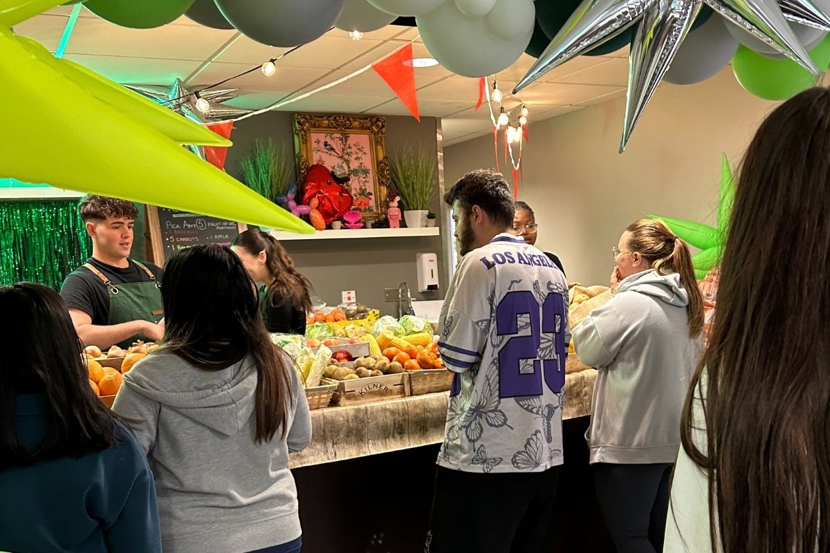 Students lining up to get some free fruit and veg