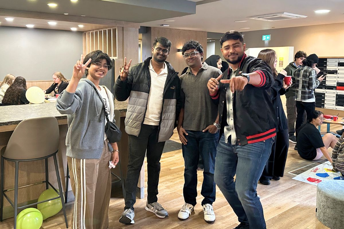 a group of people in the CODE communal areas posing in front of the camera