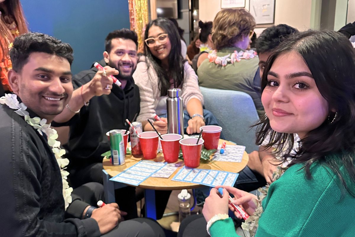 Friends playing bingo together at the tropical bingo event at CODE