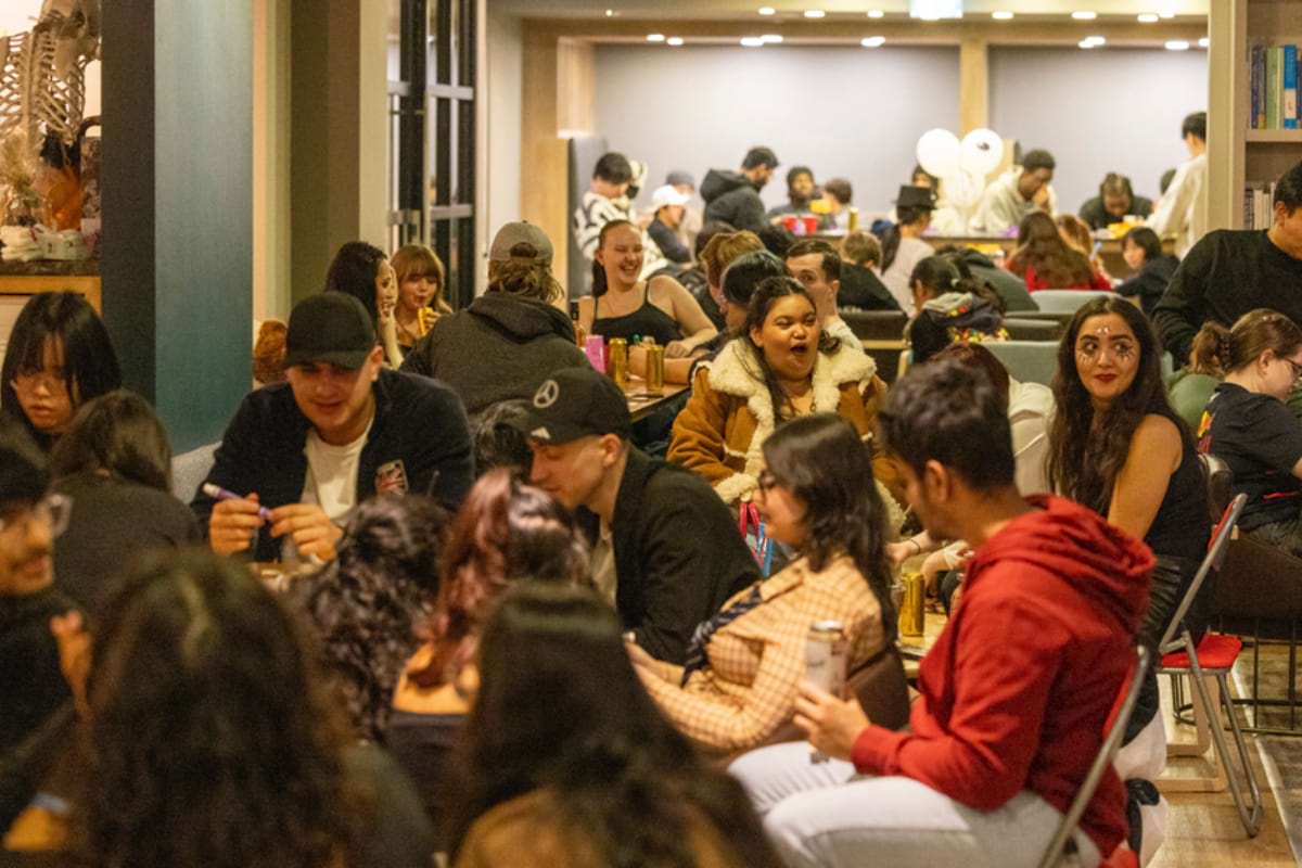 Code students enjoying the halloween bingo event