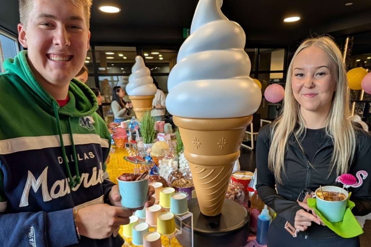 A boy and a girl posing with their Easter goodies