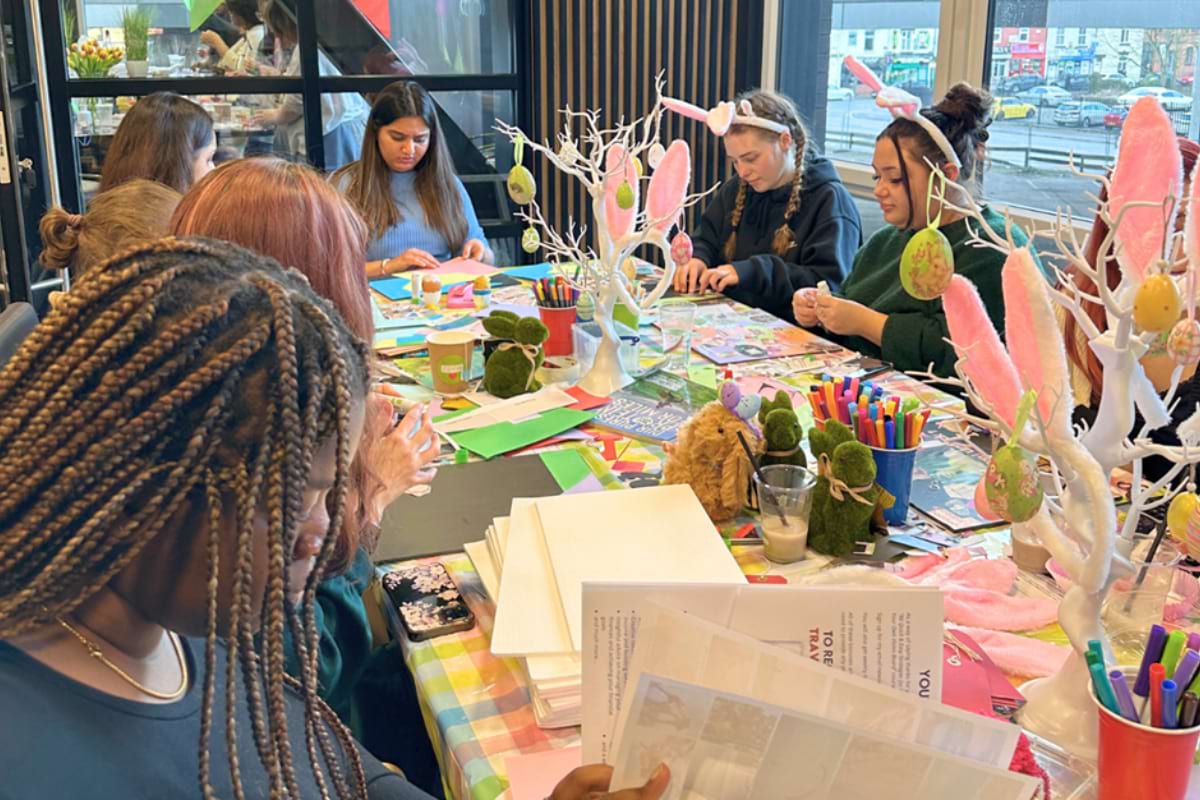 A group of CODE residents enjoying arts and crafts