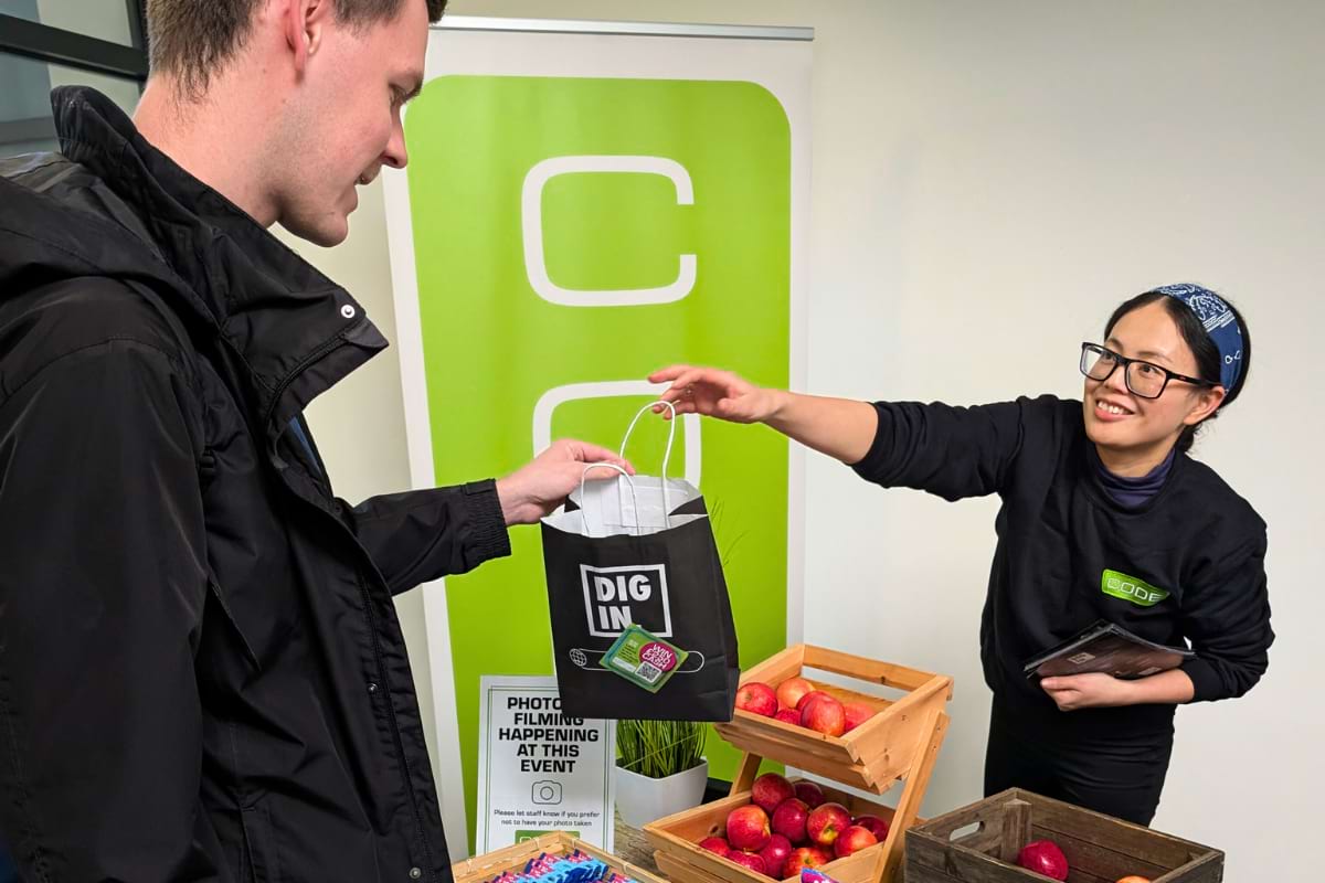 staff member handing bag to tenant