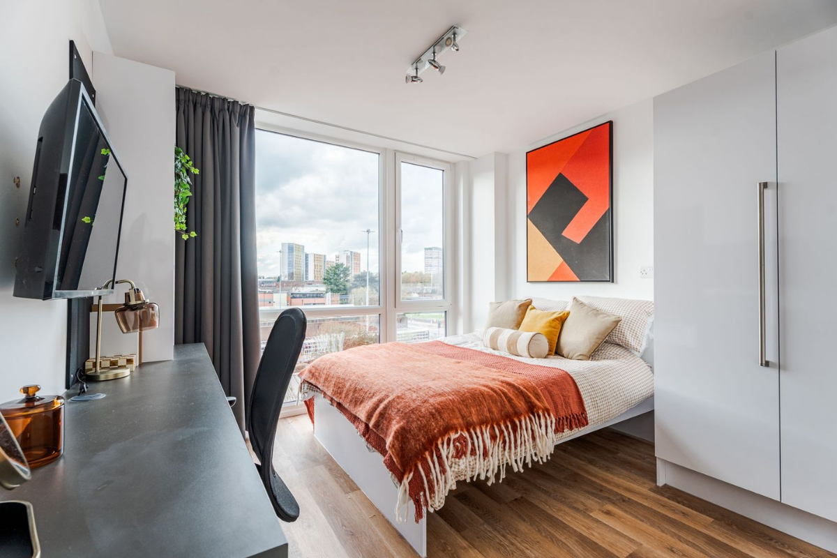 Bedroom in a two-bedroom apartment with modern furniture
