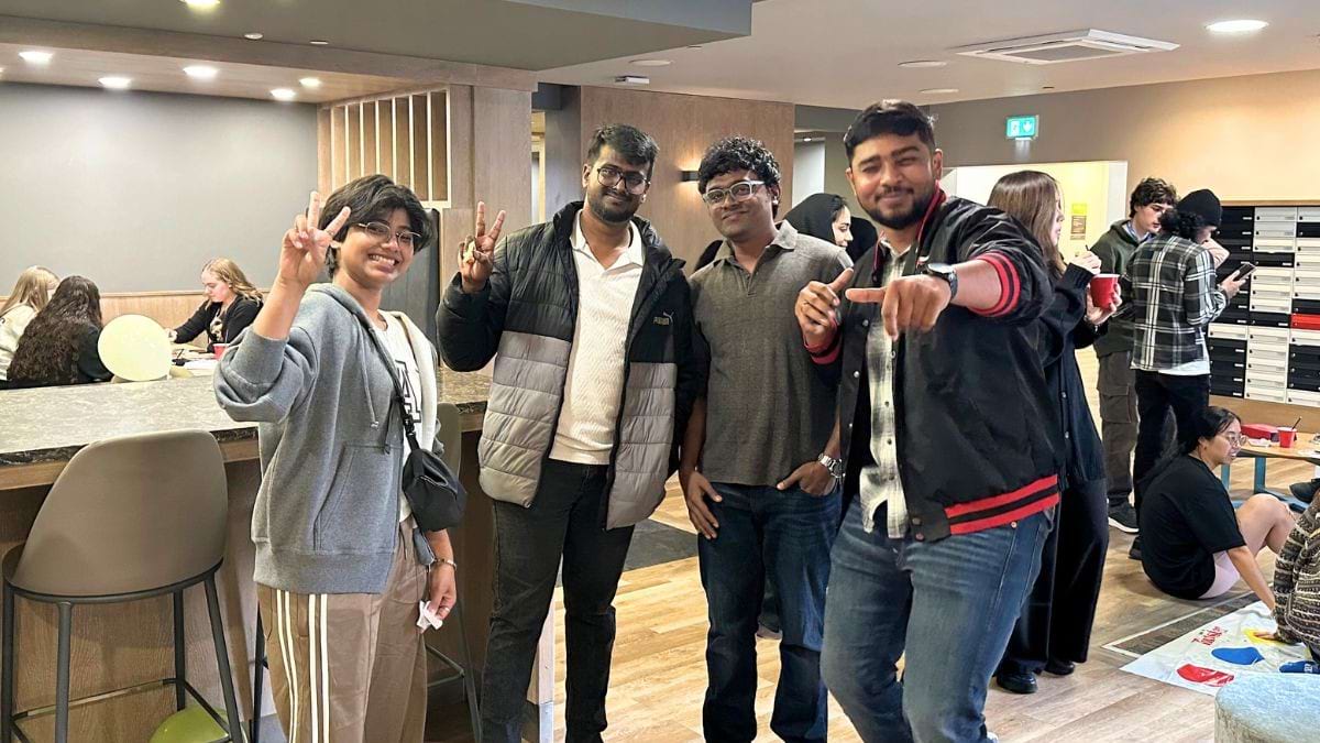 a group of people in the CODE communal areas posing in front of the camera