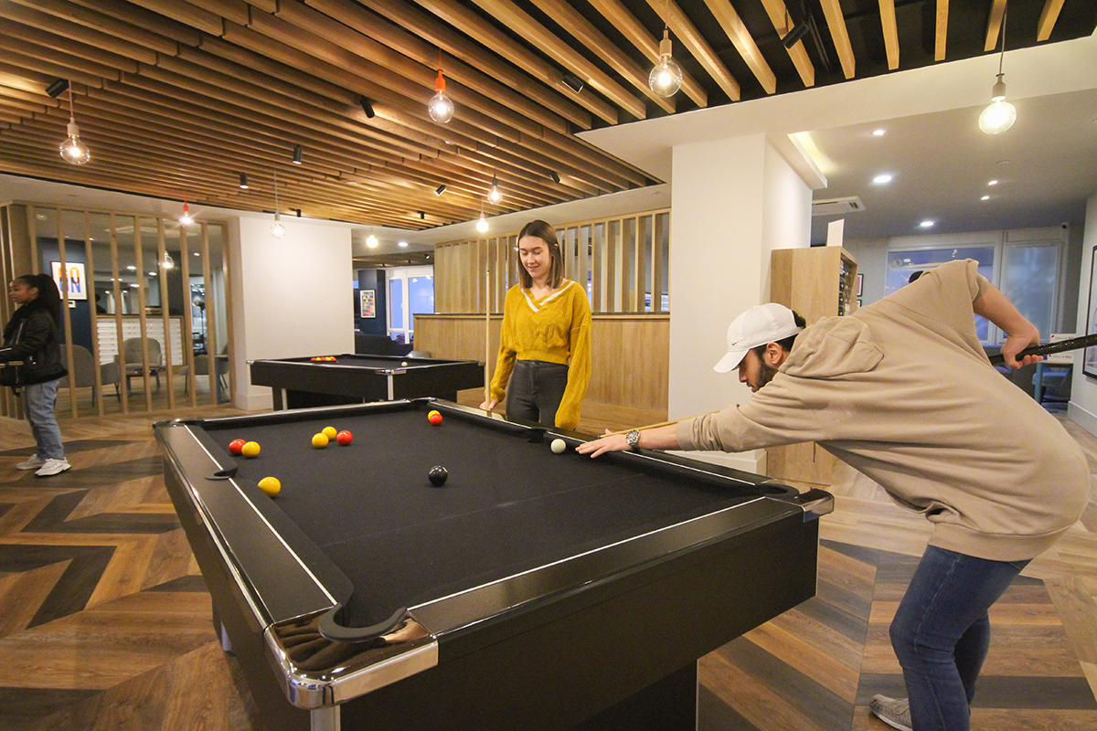 Students playing pool CODE Student Accommodation Coventry