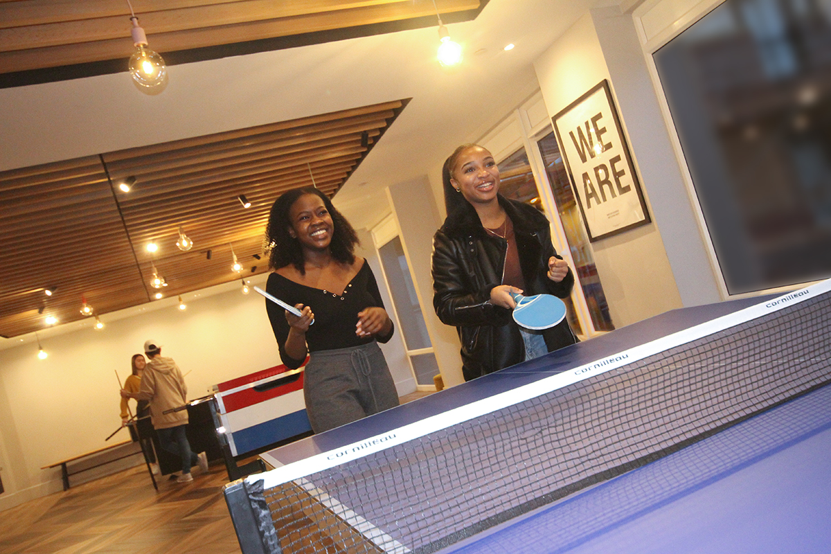 Students playing table tennis CODE Student Accommodation Coventry