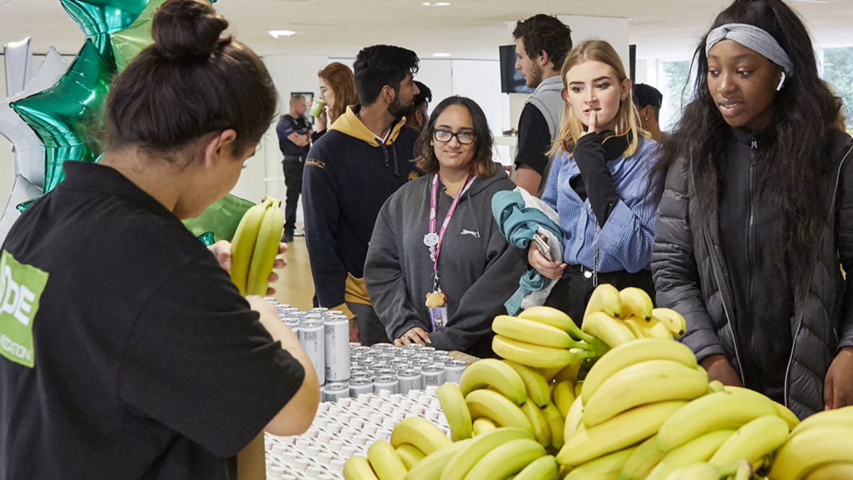 Students collecting bananas and water at CODE Student Accommodation Leicester giveaway